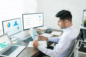 A man thinking and analysing the information to work on his expert witness report writing 