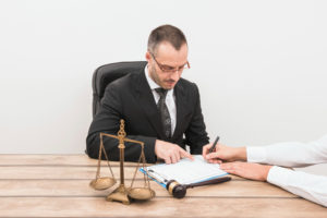 A lawyer instructing and helping expert witness