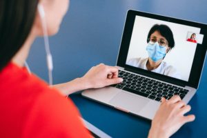 Medical professional video conferencing discussing effective ways of reputation management for doctors