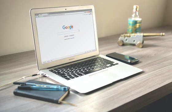 macbook-air-on-grey-wooden-table