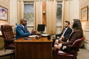 A group of people having discussion inside an office
