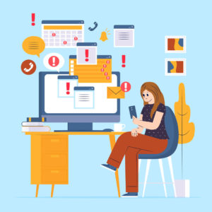 Woman-at-desk-ignoring-computer-full-of-alert-popups-while-using-phone.