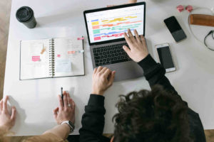 person-in-black-long-sleeve-shirt-using-macbook-pro