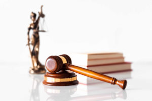 wooden-judge-hammer-in-law-office