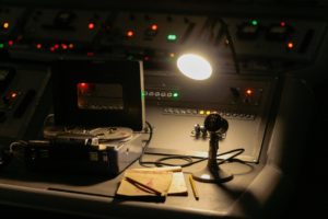 a-desk-with-a-light-and-a-camera-on-it
