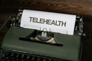 a-close-up-of-a-typewriter-with-a-paper-on-it