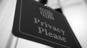 a-black-and-white-photo-of-a-sign-that-says-privacy-please