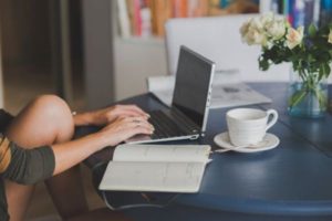 Person-Using-Black-and-Silver-Laptop-Computer