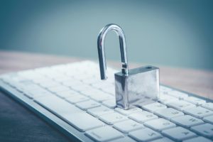 a-padlock-sitting-on-top-of-a-computer-keyboard