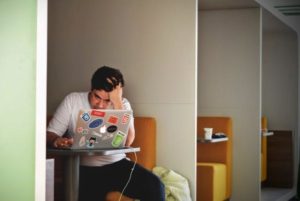 man-in-a-white-shirt-using-macbook