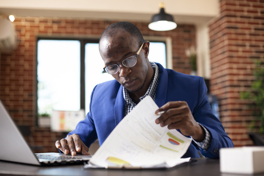 man looking at document