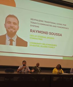 Raymond Soussa speaking at an event.