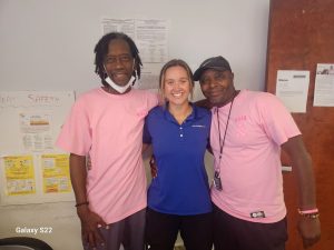 Emily Wallschlaeger with two Savannah employees.