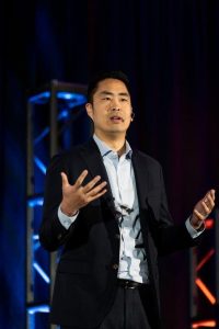 Rich-Woo-speaking-at-a-conference.